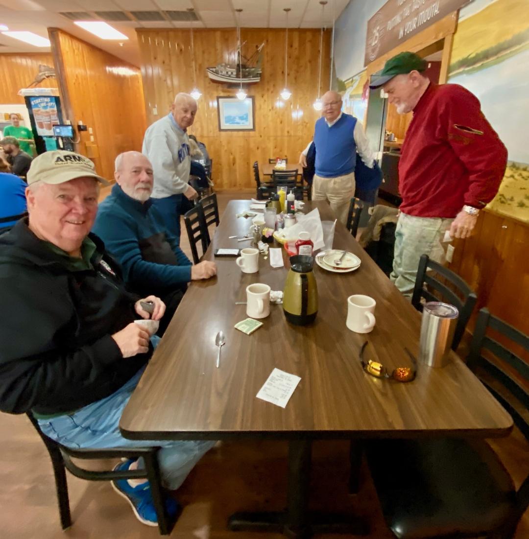 Men gathered for breakfast or prayer